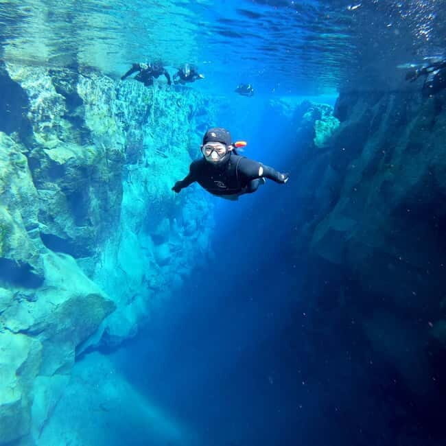 From Reykjavik: Silfra Snorkeling with Free Photos - Silfra’s 100-Meter Blue: What Makes It Look Unreal